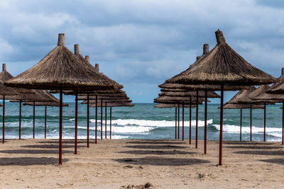 Built structure on beach against sky