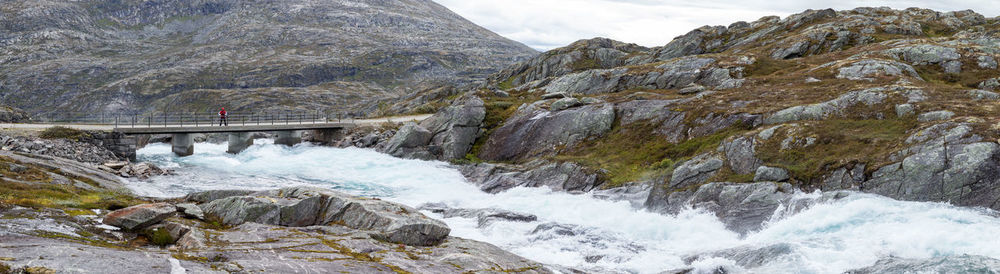 Scenic view of river flowing through rocks