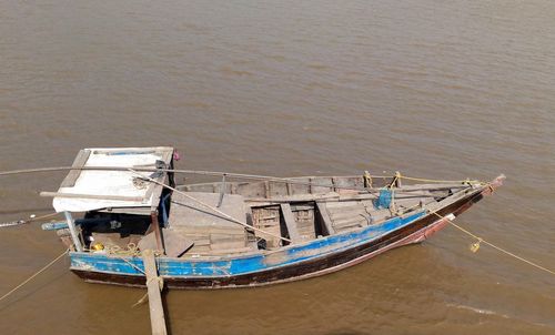 High angle view of fishing boat moored at beach