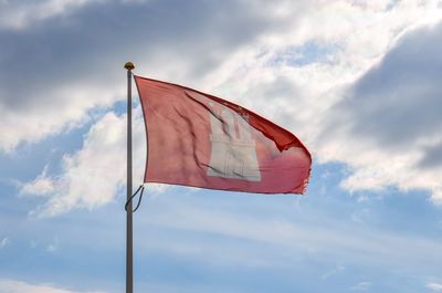 Low angle view of flag against sky