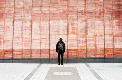 Full length rear view of a man walking