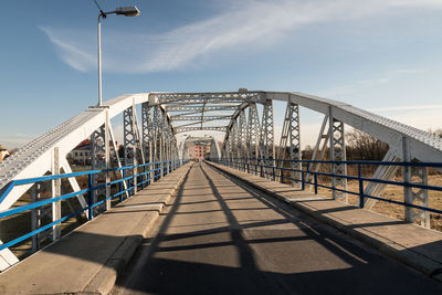 Footbridge against sky