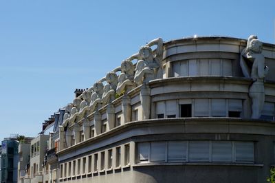 Low angle view of building against clear blue sky