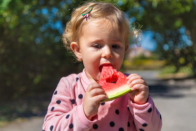 Close-up of girl eating food