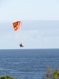 View of people in sea against sky