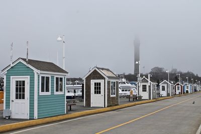 Wooden market shops along fishing pier in new england art colony