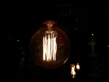 Close-up of illuminated light bulb
