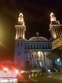Low angle view of illuminated cathedral at night