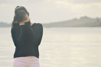 Woman standing on beach