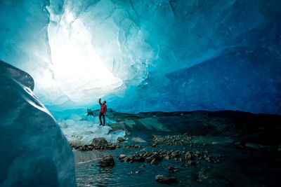 Man surfing in cave