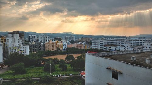 High angle view of buildings against sky during sunset