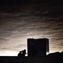 Low angle view of built structure against cloudy sky