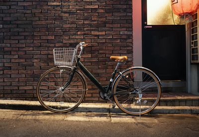 Bicycle parked against wall