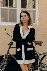 Side view of woman sitting on bicycle