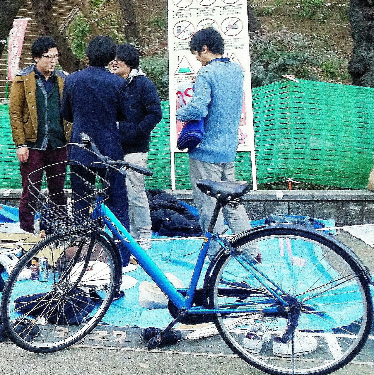 bicycle, wall - building feature, leaning, mode of transport, stationary, day, transportation, land vehicle, outdoors, stone wall, parked, blue, childhood, built structure, parking, wheel, wall, sidewalk