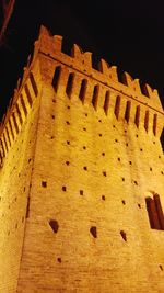 Low angle view of building against sky at night