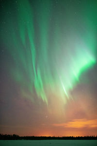 Aerial view of landscape against sky at night