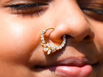 Close-up portrait of girl wearing nose ring