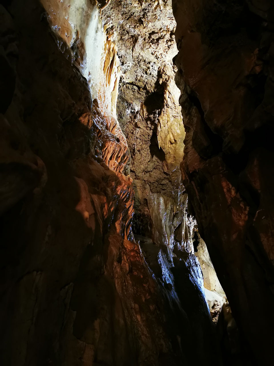 rock, cave, rock formation, caving, geology, stalactite, no people, nature, indoors, physical geography, beauty in nature, illuminated, low angle view, pattern, non-urban scene, textured, tranquility, eroded, rough, stalagmite