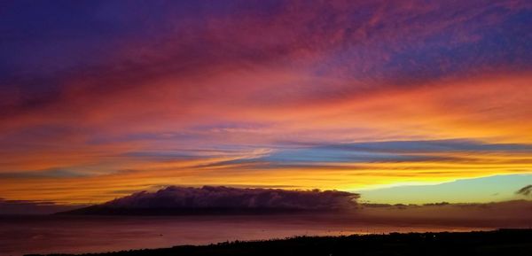 Scenic view of dramatic sky during sunset