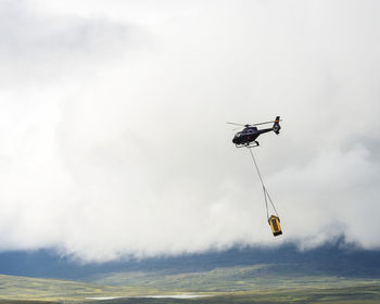 Helicopter carrying load