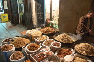 Man having food at market stall