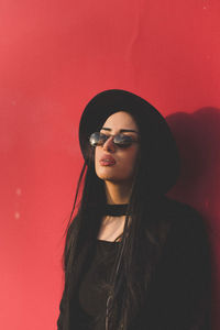 Portrait of young woman wearing sunglasses