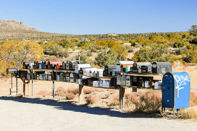 Various mailboxes at roadside on sunny day