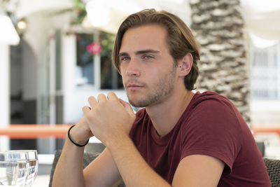 Portrait of man sitting in restaurant