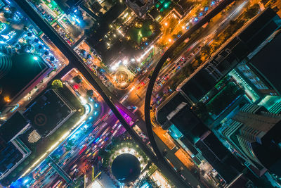 High angle view of illuminated buildings in city at night