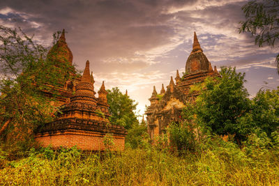 View of temple building against cloudy sky