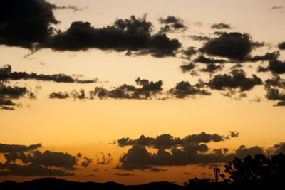 Scenic view of mountains against sky at sunset