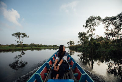 Panoramic view of boat in lake against sky