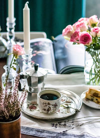 Close-up of roses in vase on table