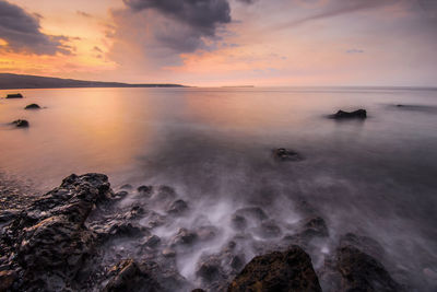 Scenic view of sea against sky during sunset