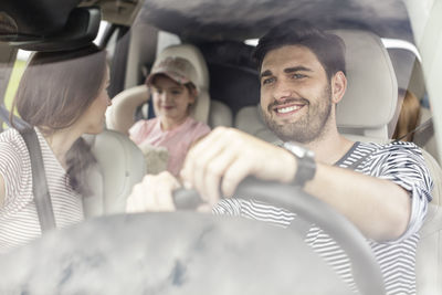 Happy family doing a road trip