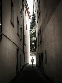 Narrow alley along buildings