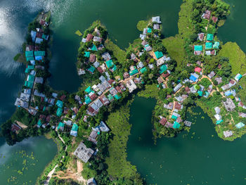 High angle view of people by boats in sea