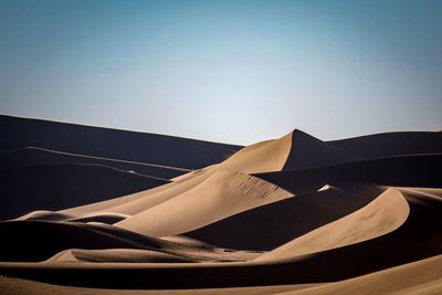 Scenic view of desert against clear sky