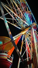 Low angle view of illuminated ferris wheel