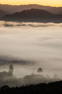 Scenic view of silhouette mountains against sky during sunset