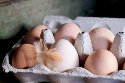 Fresh eggs from our chickens - and a feather from a chicken.