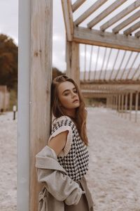 Portrait of smiling young woman looking away