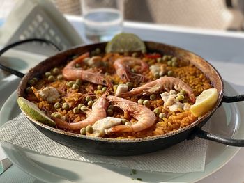 High angle view of seafood rice in plate on table