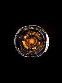 Directly below shot of glass against black background