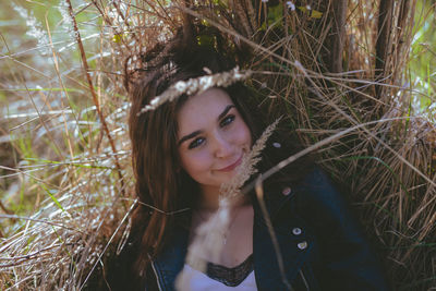 Portrait of beautiful young woman in forest