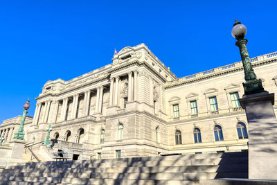 Low angle view of building against blue sky