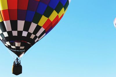 Low angle view of hot air balloon against blue sky