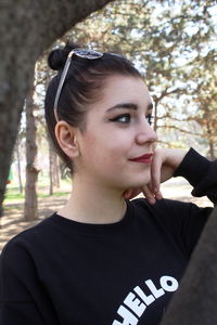 Portrait of a beautiful young woman looking away