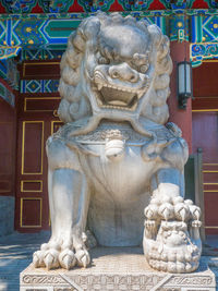 Close-up of statue against building